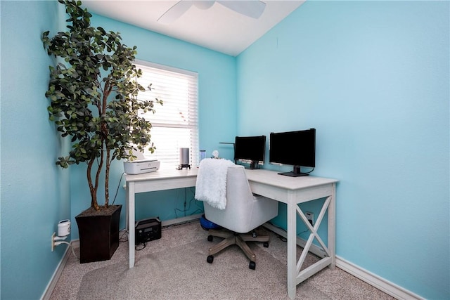 home office featuring light carpet, baseboards, a ceiling fan, and lofted ceiling