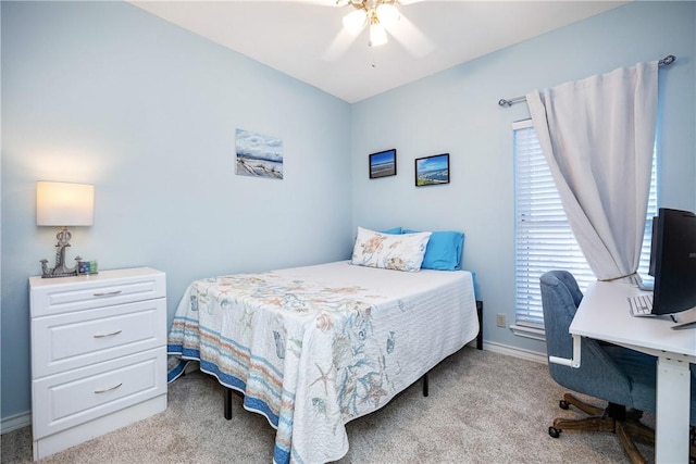 bedroom with a ceiling fan, carpet flooring, and baseboards