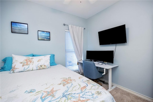 bedroom with carpet floors, baseboards, and a ceiling fan