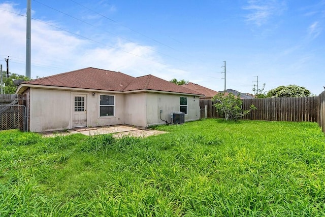 1606 W Nelson Ave, Aransas Pass, TX 78336 - rear view of house with a fenced backyard and a patio