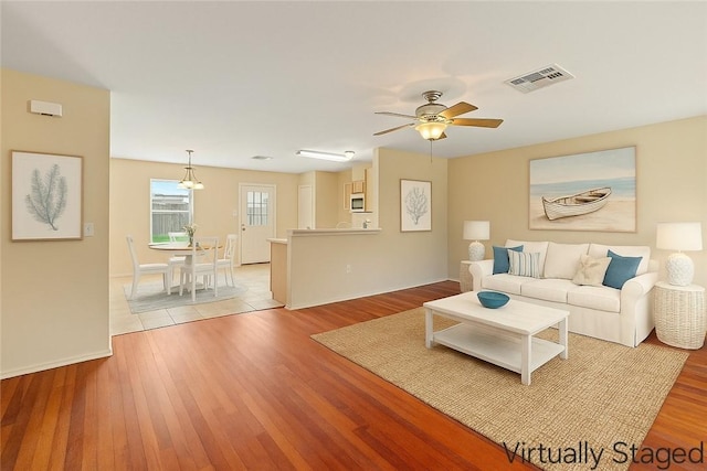1606 W Nelson Ave, Aransas Pass, TX 78336 - living area featuring light wood finished floors and ceiling fan