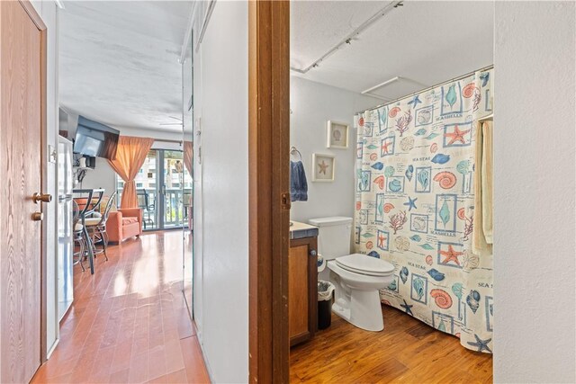 3938 Surfside Blvd Unit 3118, Corpus Christi, TX 78402 - full bath featuring wood finished floors, a shower with shower curtain, and vanity