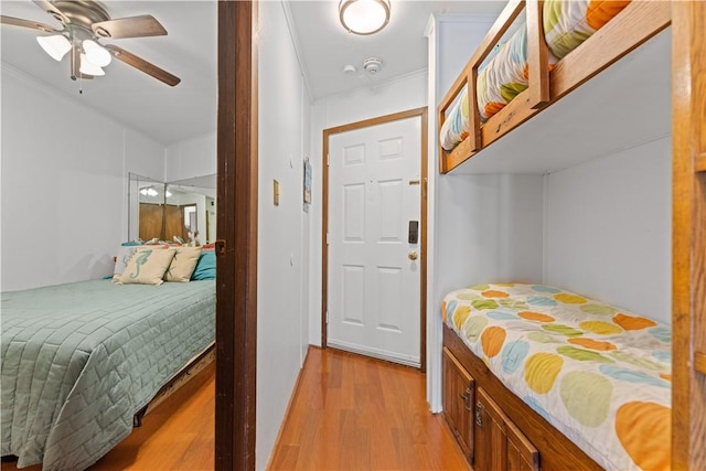 3938 Surfside Blvd Unit 3118, Corpus Christi, TX 78402 - bedroom with light wood-style flooring, crown molding, and ceiling fan