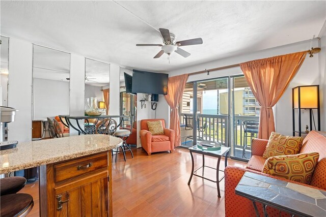 3938 Surfside Blvd Unit 3118, Corpus Christi, TX 78402 - living room featuring ceiling fan and light wood-style flooring