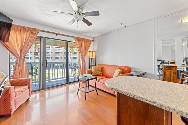 3938 Surfside Blvd Unit 3118, Corpus Christi, TX 78402 - living room with ceiling fan and light wood-style floors