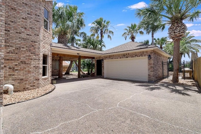 6302 Grandvilliers Dr, Corpus Christi, TX 78414 - view of side of home featuring a garage, brick siding, driveway, and a shingled roof