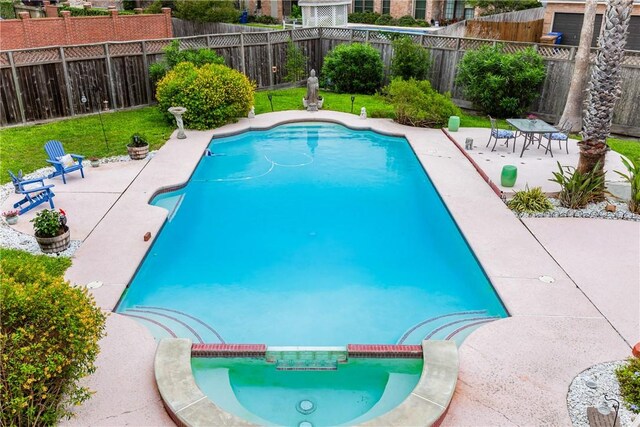 6910 Sir Galahad, Corpus Christi, TX 78413 - view of swimming pool featuring a patio area and a pool with connected hot tub