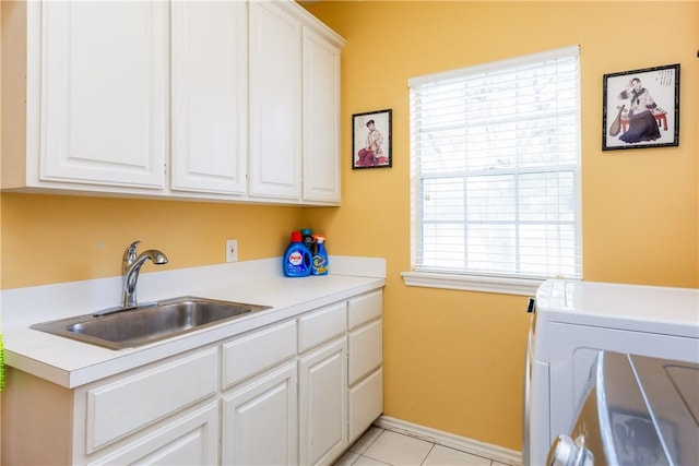 6910 Sir Galahad, Corpus Christi, TX 78413 - washroom featuring cabinet space, washer / dryer, and light tile patterned floors