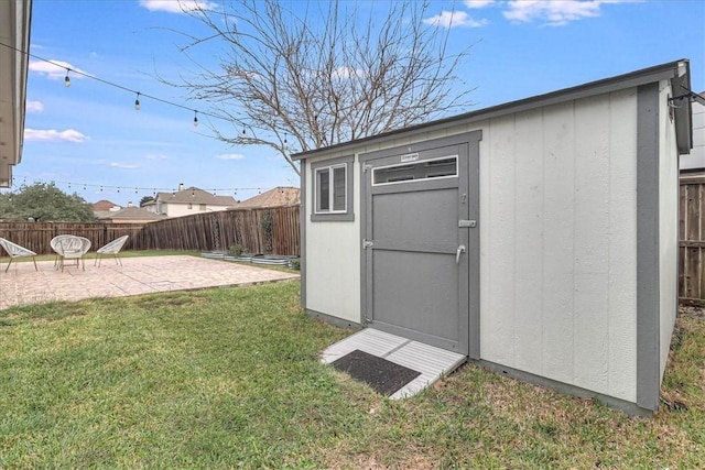 view of shed featuring a fenced backyard