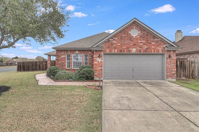 view of front of property featuring driveway, fence, a front lawn, and brick siding