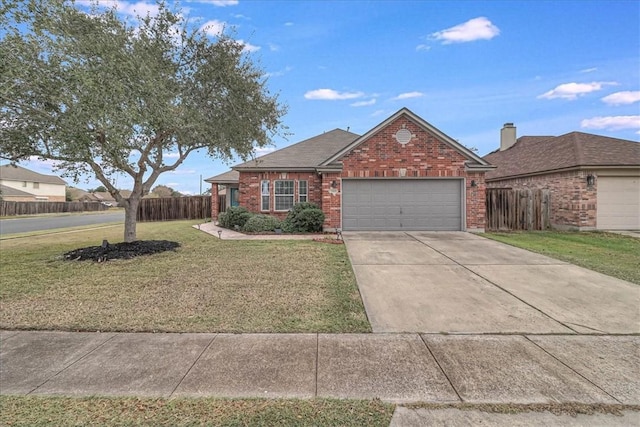 view of front of property with brick siding, concrete driveway, an attached garage, fence, and a front yard