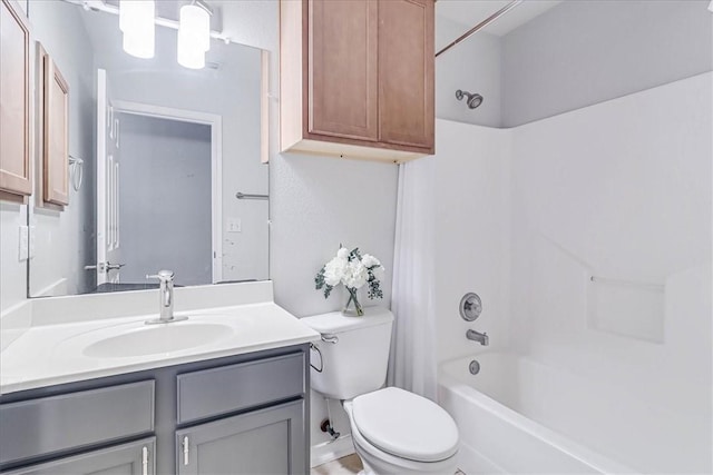 bathroom featuring shower / washtub combination, vanity, and toilet