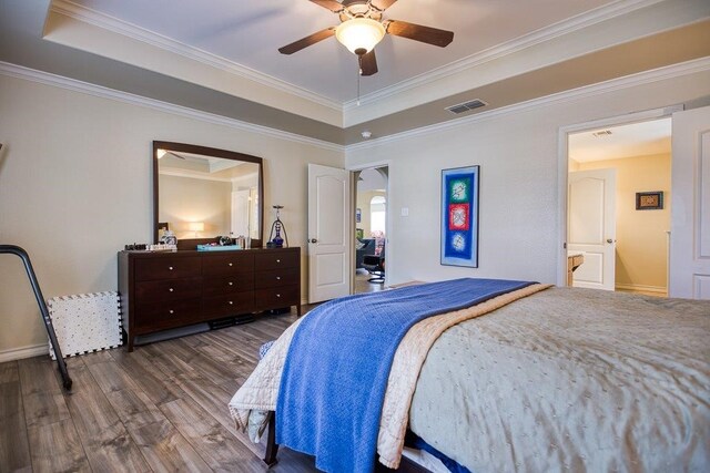 324 Nicklaus Dr, Portland, TX 78374 - bedroom with a tray ceiling, wood-type flooring, ornamental molding, and ceiling fan