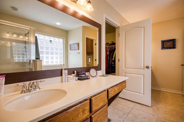 324 Nicklaus Dr, Portland, TX 78374 - bathroom with tile patterned flooring, vanity, and a shower with shower door