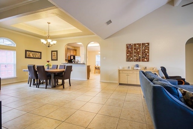 324 Nicklaus Dr, Portland, TX 78374 - tiled dining room with an inviting chandelier, a towering ceiling, ornamental molding, and a raised ceiling