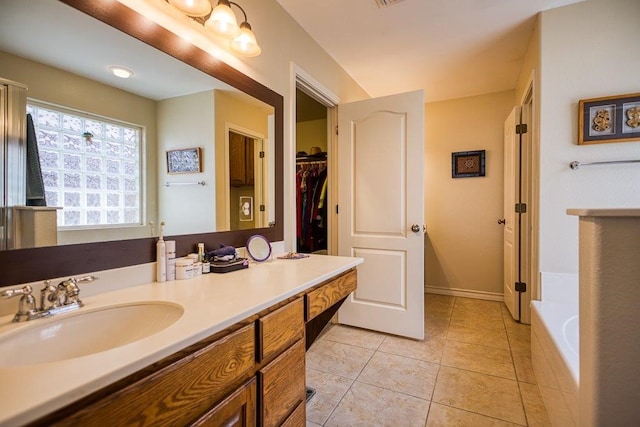 324 Nicklaus Dr, Portland, TX 78374 - bathroom with vanity, tile patterned floors, and a bathtub