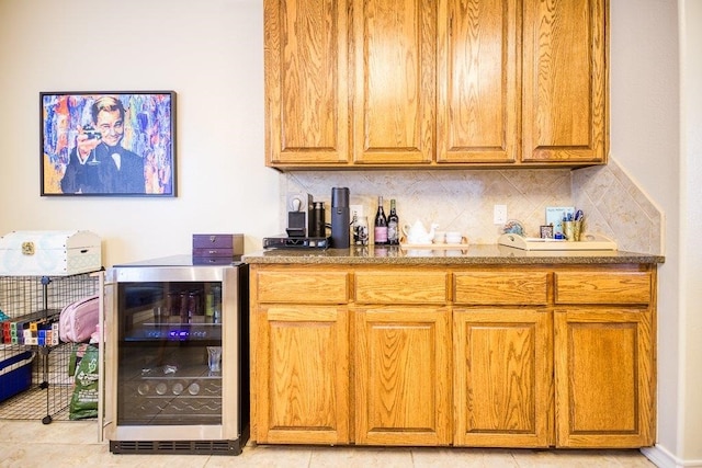 324 Nicklaus Dr, Portland, TX 78374 - bar featuring wine cooler and decorative backsplash
