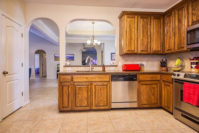 324 Nicklaus Dr, Portland, TX 78374 - kitchen with tasteful backsplash, stainless steel appliances, a raised ceiling, and sink