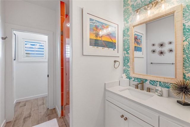 bathroom with hardwood / wood-style floors and vanity