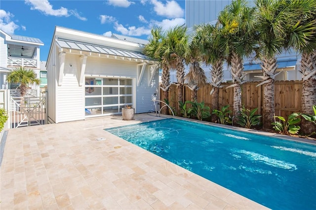 view of swimming pool featuring a patio area