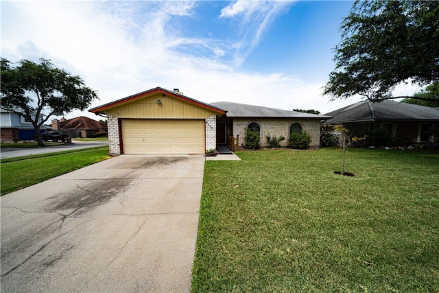 ranch-style home with a garage and a front lawn