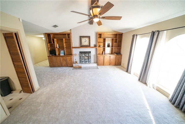 living room with light carpet, vaulted ceiling, and ceiling fan