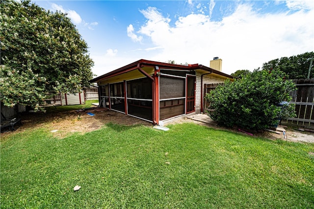 view of yard featuring a sunroom