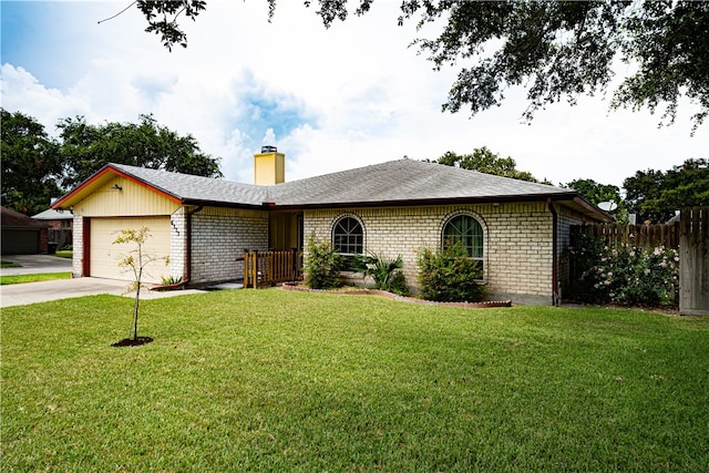 single story home with a front yard and a garage