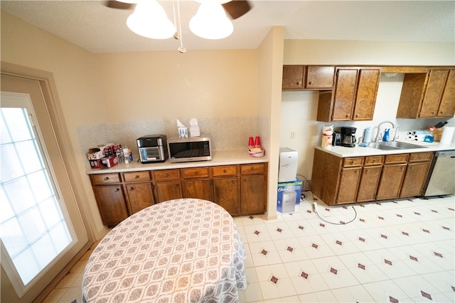 kitchen with ceiling fan, sink, stainless steel appliances, and plenty of natural light