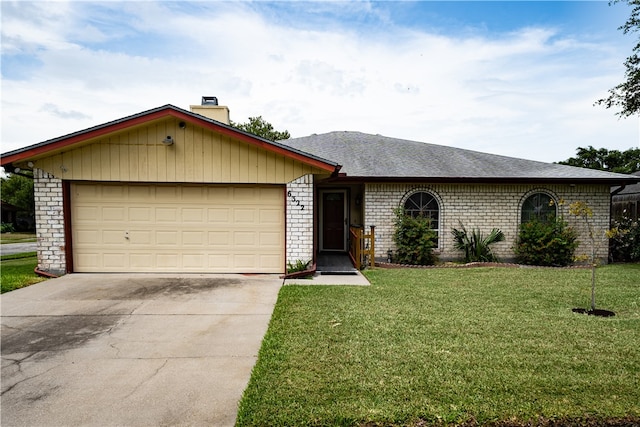 ranch-style house featuring a front yard and a garage