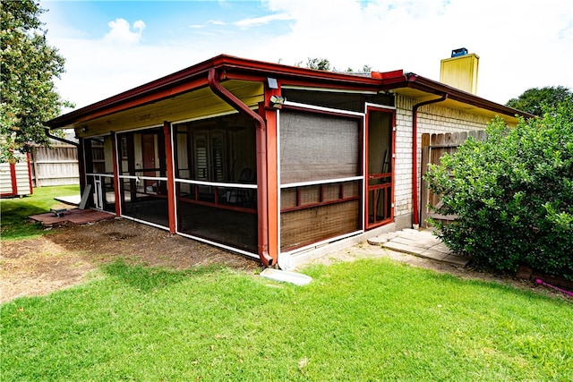 exterior space featuring a sunroom