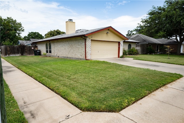 view of side of property featuring a yard and a garage