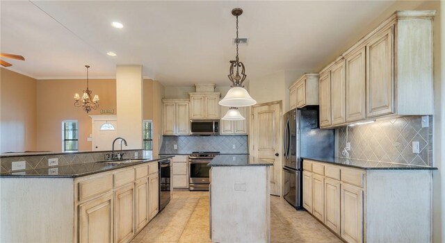 kitchen with a kitchen island with sink, a sink, visible vents, backsplash, and appliances with stainless steel finishes