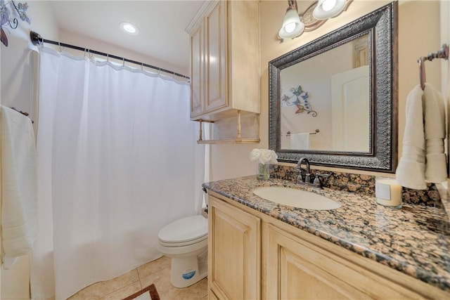 bathroom featuring toilet, recessed lighting, tile patterned flooring, and vanity