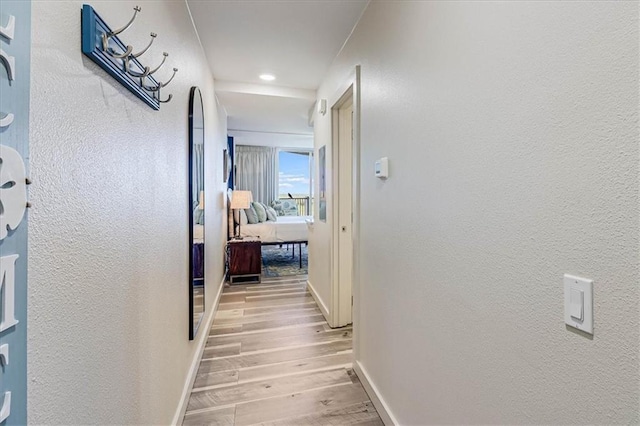 corridor featuring light hardwood / wood-style floors