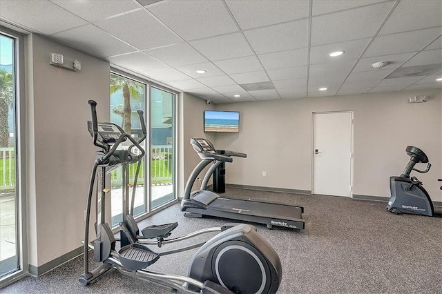 exercise area with a paneled ceiling