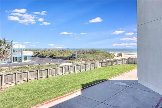 view of yard featuring a water view and a patio