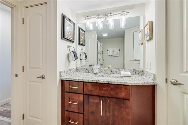 bathroom with wood-type flooring and vanity