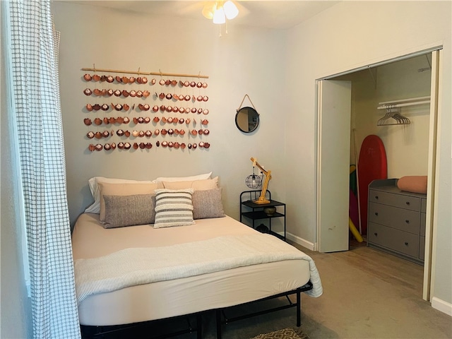 bedroom featuring ceiling fan and a closet