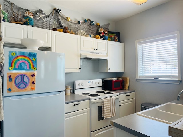 kitchen featuring white appliances, white cabinetry, and sink