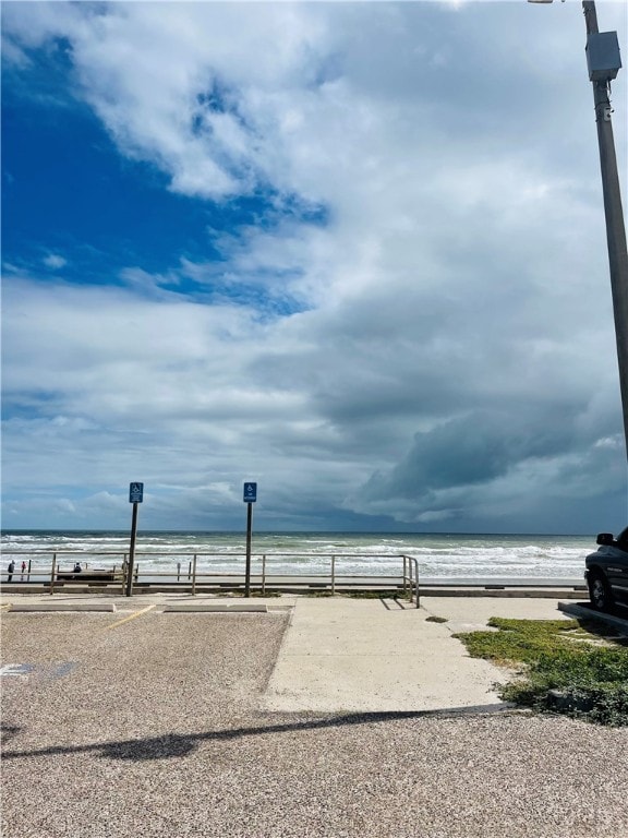 property view of water featuring a view of the beach