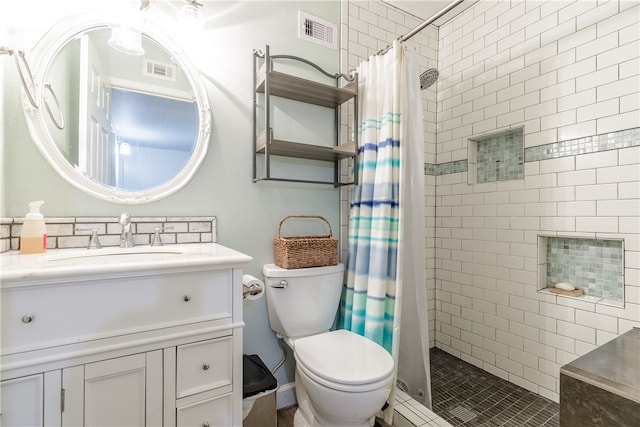 bathroom featuring vanity, toilet, and a shower with curtain