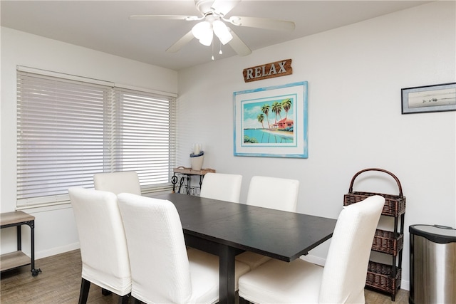 dining area featuring ceiling fan and wood-type flooring