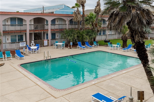 view of pool featuring a patio