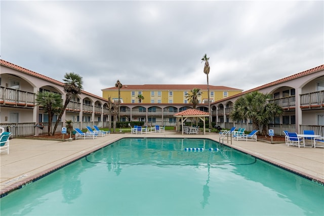 view of pool featuring a gazebo and a patio area