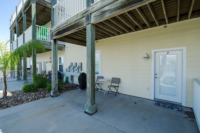 view of patio featuring a balcony