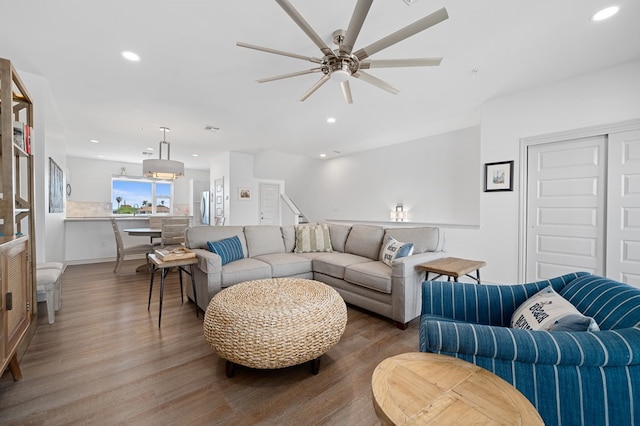 living room with hardwood / wood-style floors and ceiling fan