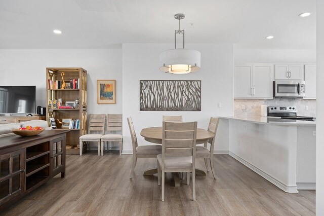 dining room featuring light wood-type flooring