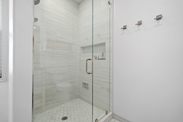 bathroom with a shower with shower door