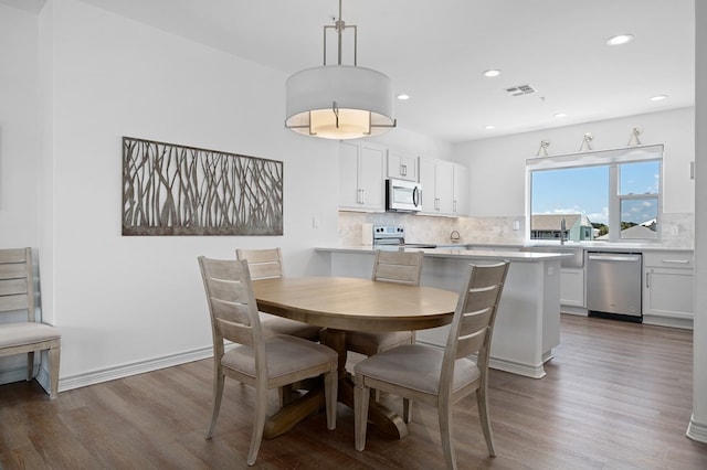 dining area featuring hardwood / wood-style flooring